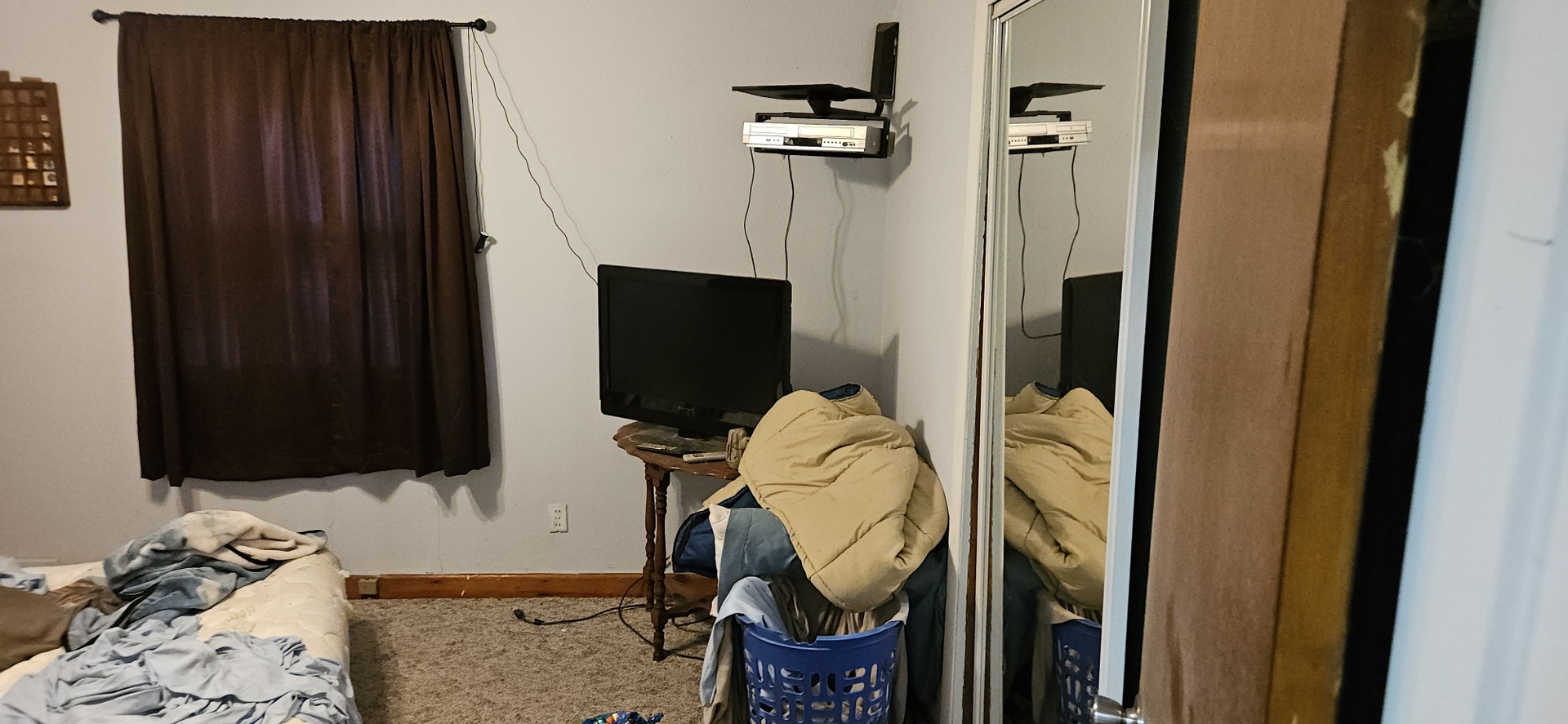 4820 8th Street Rock Island, IL 61201 - Photo 4 of 17 a bedroom with a bed and a flat tv screen