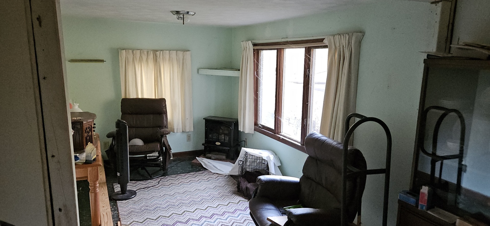 4820 8th Street Rock Island, IL 61201 - Photo 10 of 17 a living room with furniture a window and gym equipment