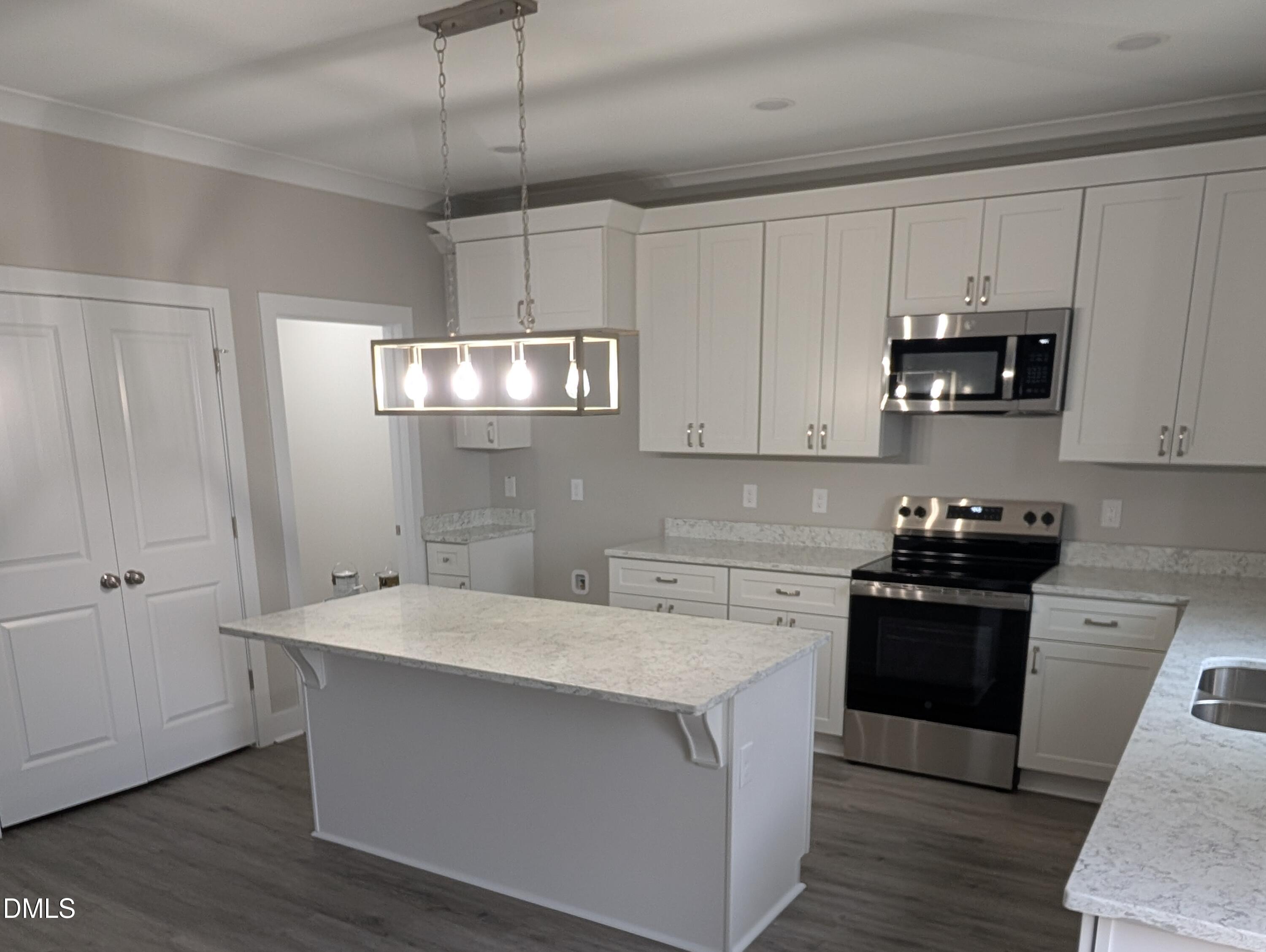 749 West Church Street Angier, NC 27501 - Photo 14 of 37 a kitchen with a sink and cabinets