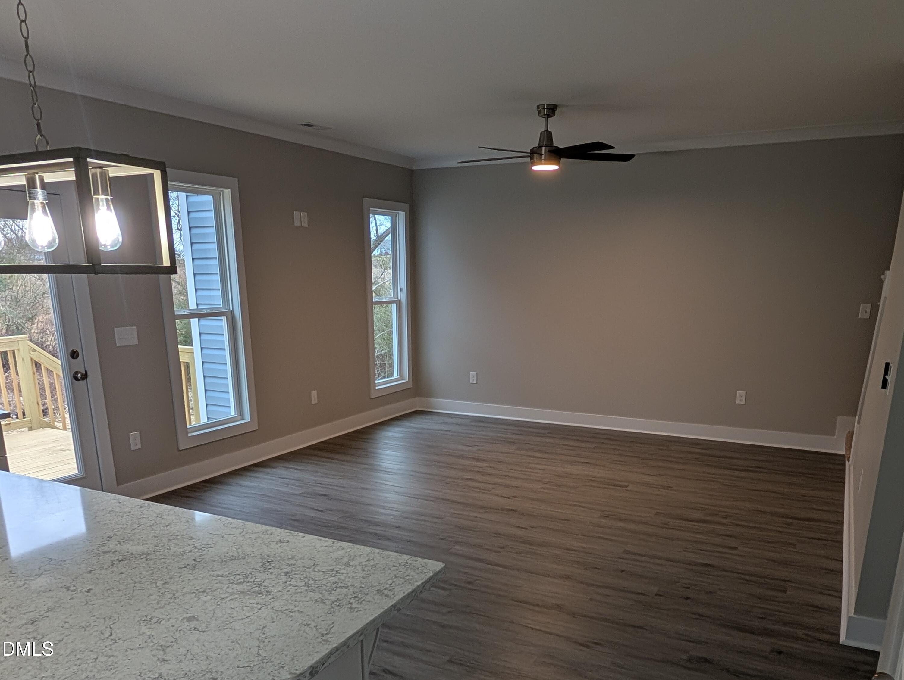 749 West Church Street Angier, NC 27501 - Photo 15 of 37 an empty room with wooden floor and mirror