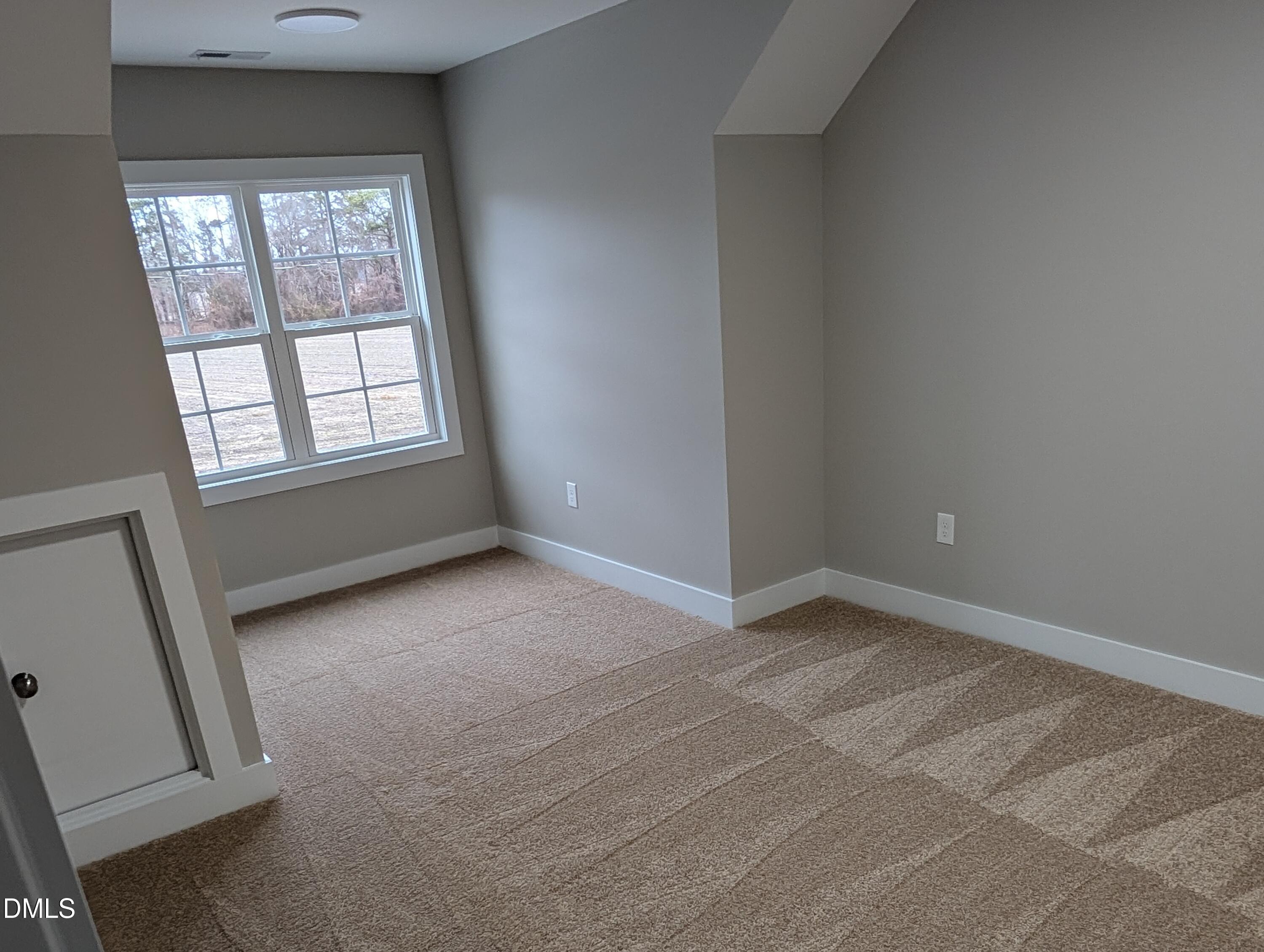 749 West Church Street Angier, NC 27501 - Photo 17 of 37 an empty room with windows