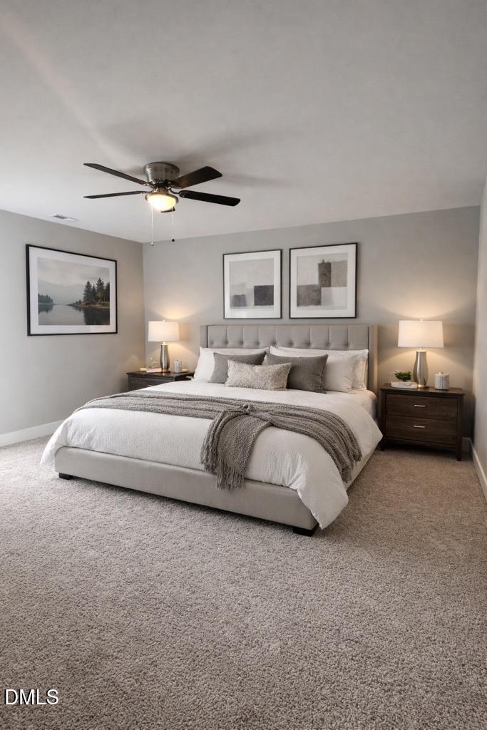 749 West Church Street Angier, NC 27501 - Photo 20 of 37 a bedroom with bed and a chandelier