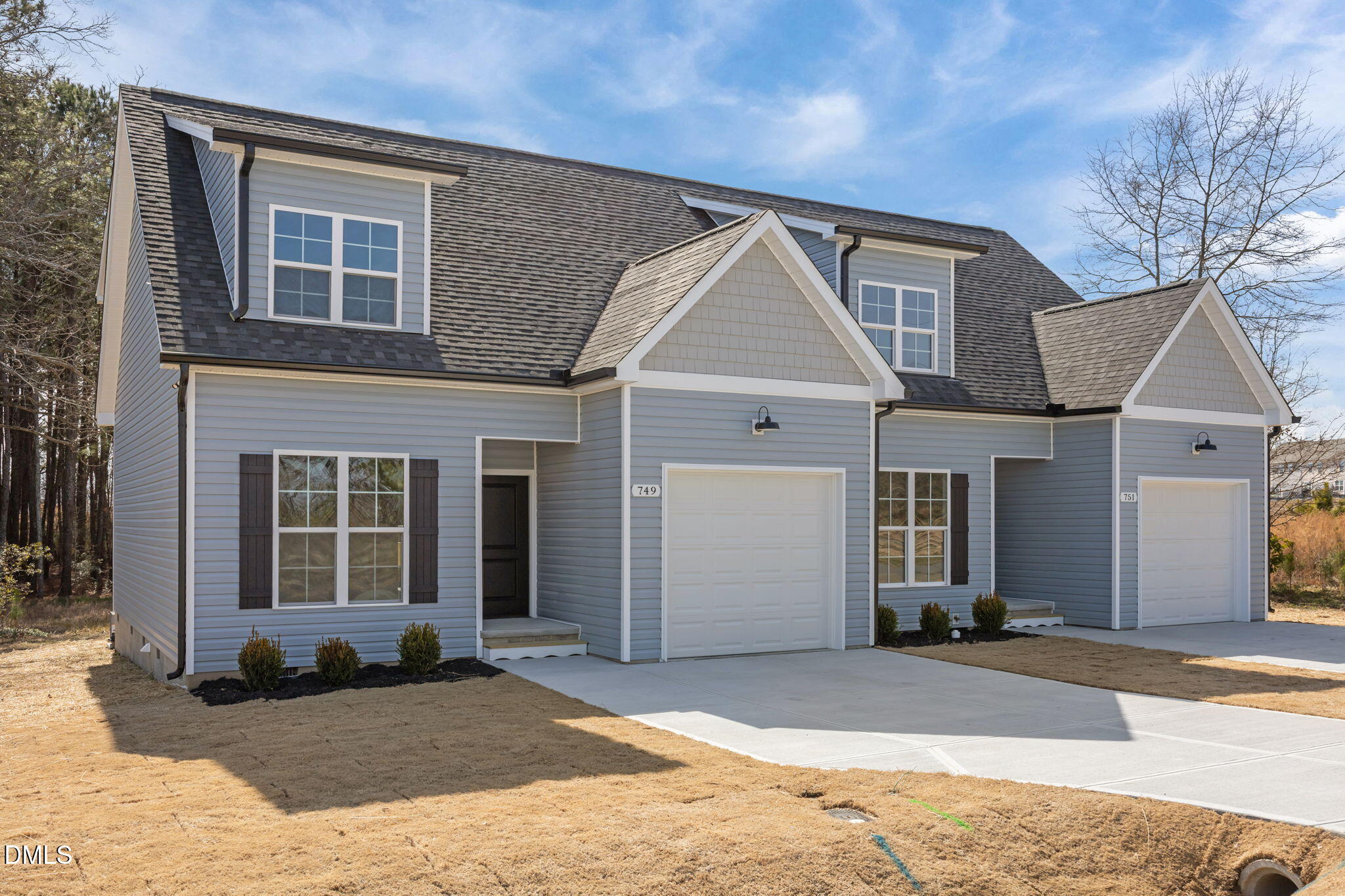 749 West Church Street Angier, NC 27501 - Photo 2 of 37 a front view of a house with a yard and garage