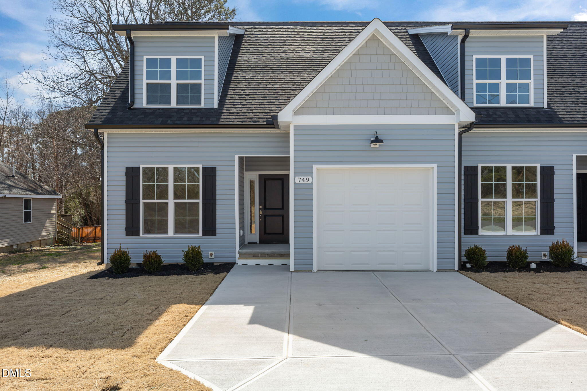 749 West Church Street Angier, NC 27501 - Photo 28 of 37 a front view of a house with a yard and garage