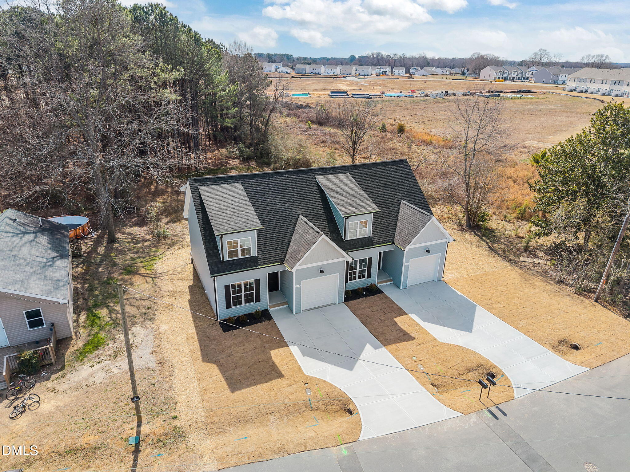 749 West Church Street Angier, NC 27501 - Photo 5 of 37 a picture of a lake with a building in the background