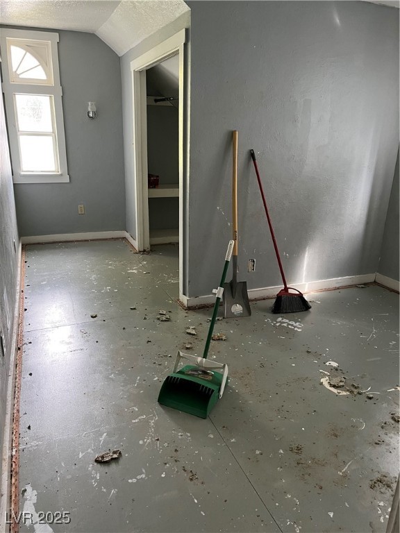 623 Murry Street Ely, NV 89301 - Photo 5 of 6 Unfurnished bedroom featuring a textured ceiling and vaulted ceiling