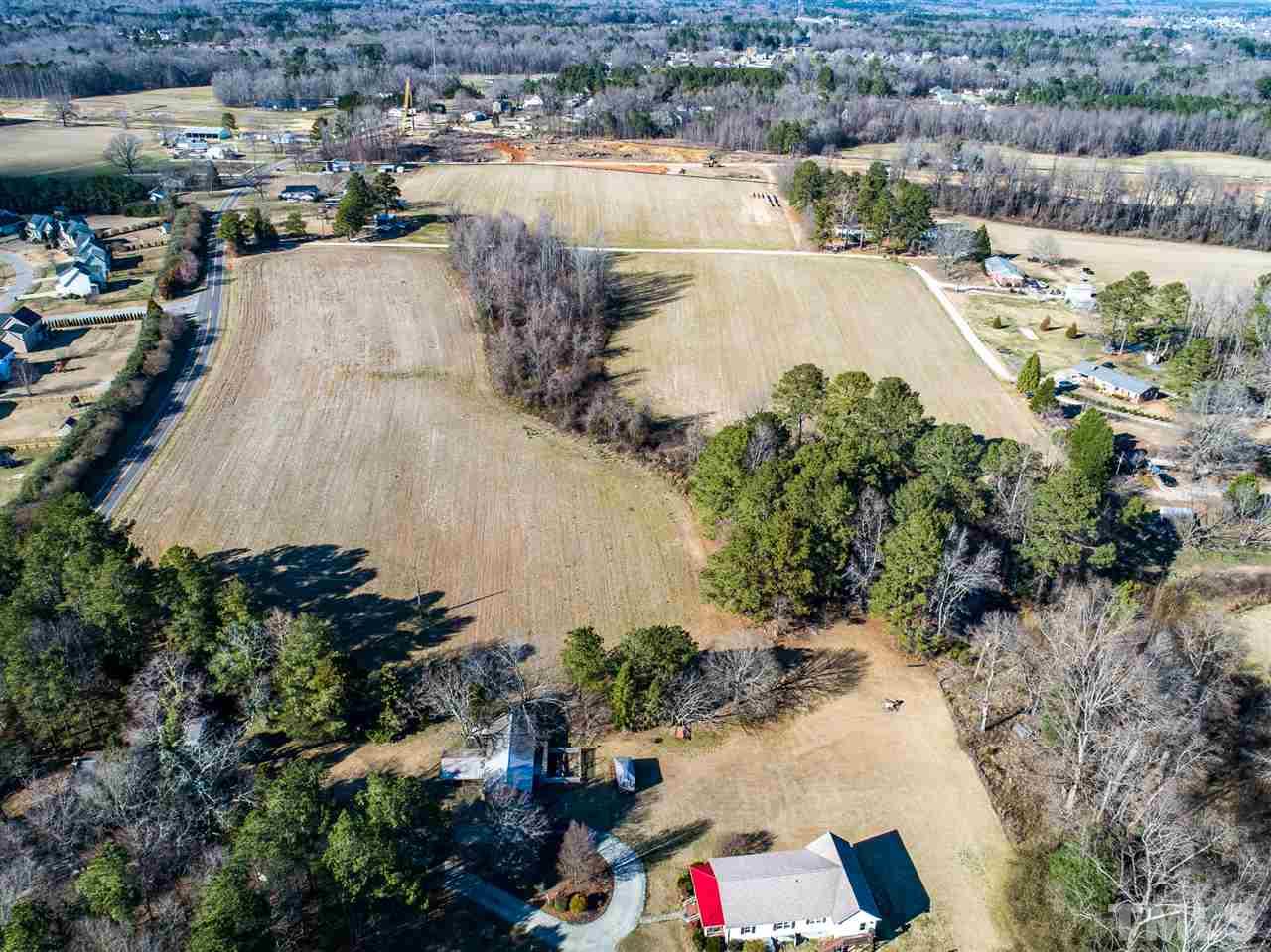 10517 Jordan Road Raleigh, NC 27603 - Photo 3 of 5 an aerial view of a house with a lake view