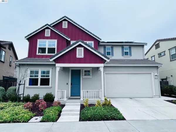 a front view of a house with yard