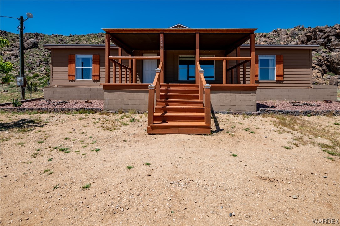5809 North Parker Road Golden Valley, AZ 86413 - Photo 1 of 1 front view of a house with a yard