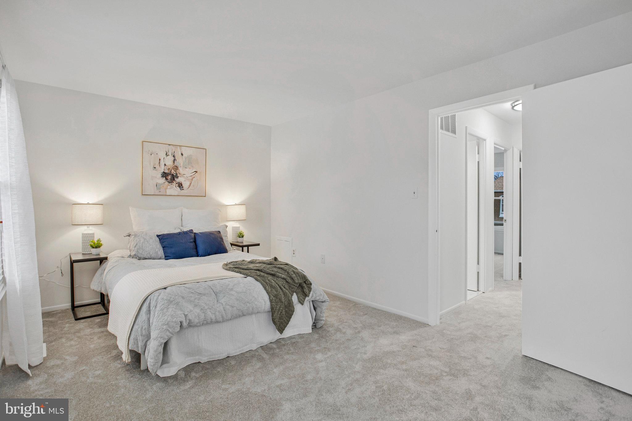 1805 Graybird Court Severn, MD 21144 - Photo 14 of 35 a bed room with a bed and a night stand