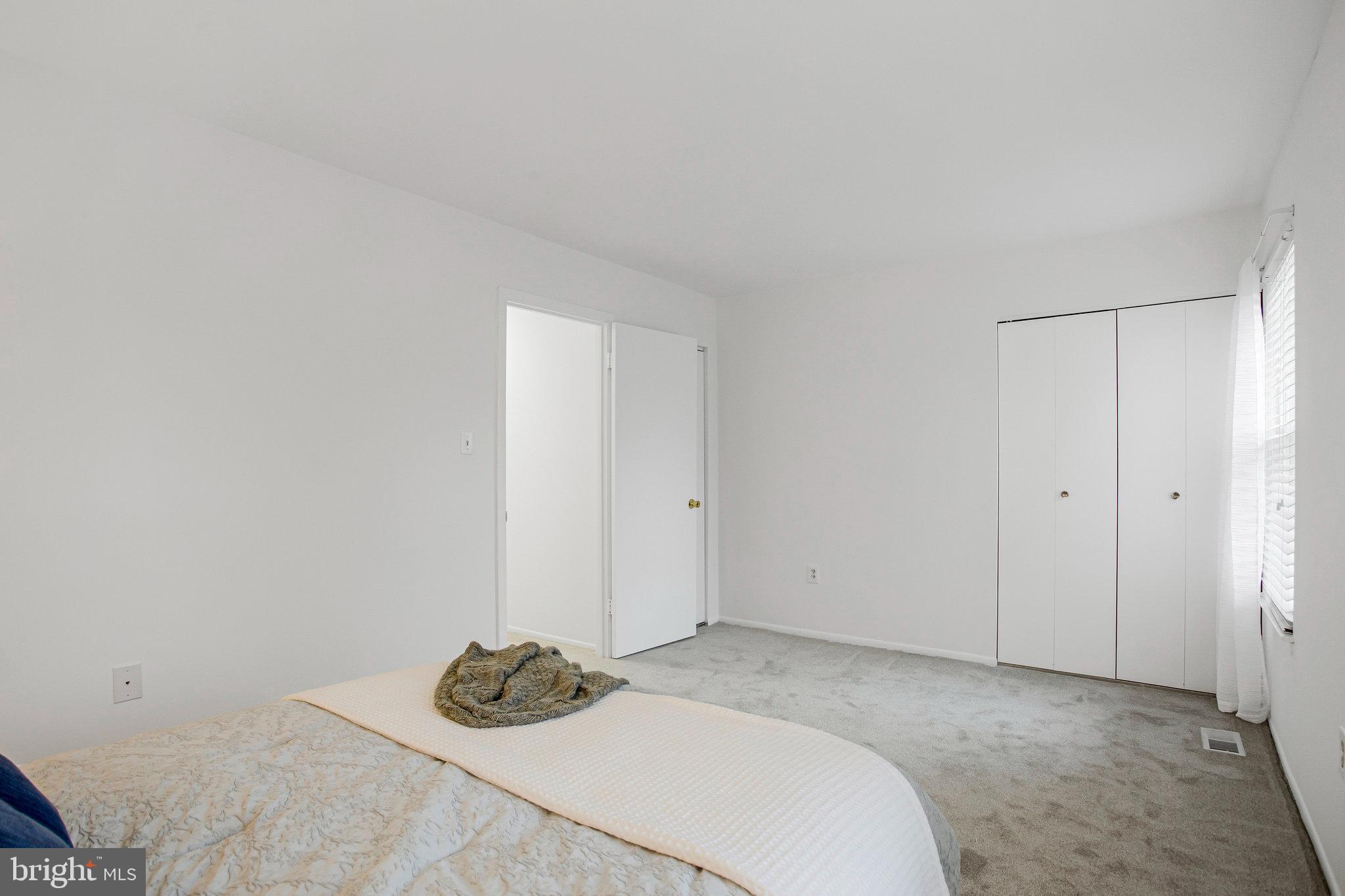 1805 Graybird Court Severn, MD 21144 - Photo 15 of 35 a bedroom with a bed and a window