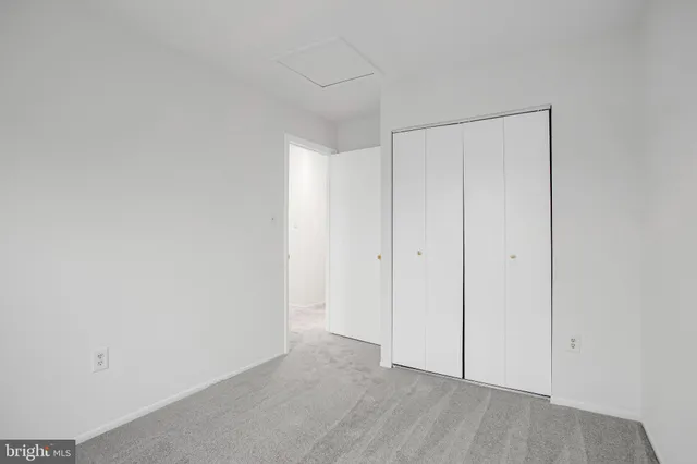 a view of an empty room with glass door