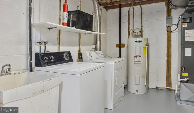 a front view of a house with a tree