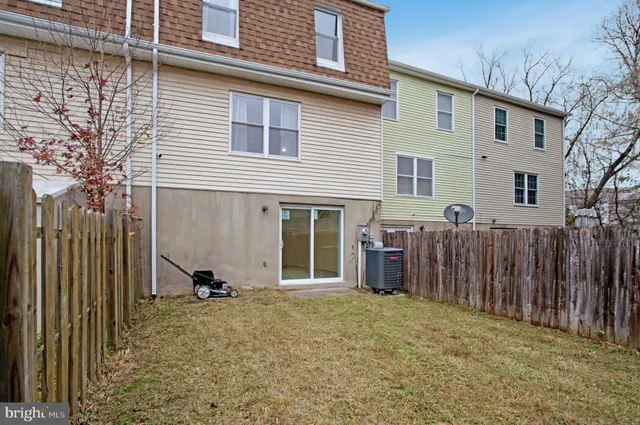 a view of a house with a backyard and a window