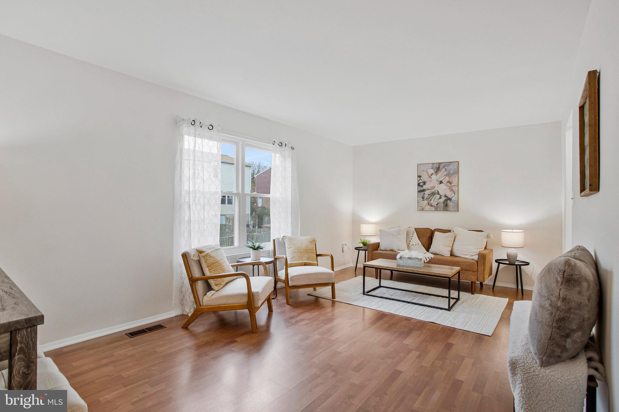 1805 Graybird Court Severn, MD 21144 - Photo 7 of 35 a living room with furniture and a wooden floor