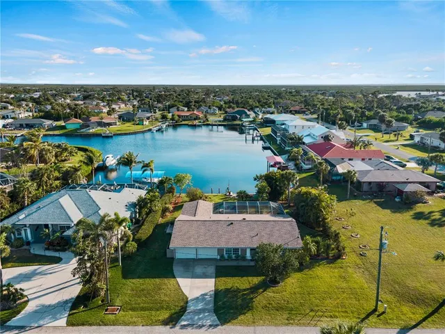 a view of a lake with a house in the background