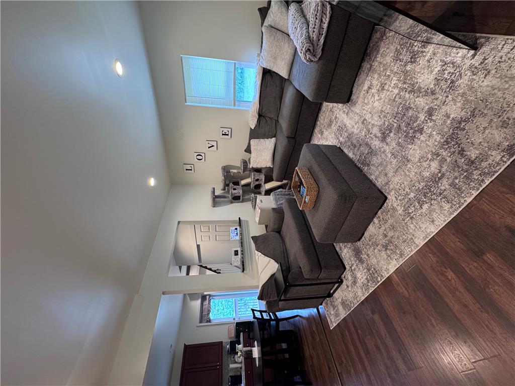 130 Hidden Spur Road Lehighton, PA 18235 - Photo 5 of 19 Well-lit living room with rich hardwood flooring and high ceilings creates an inviting atmosphere.