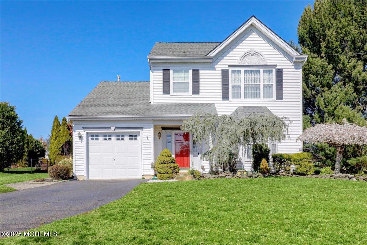 664 Adelphia Road Freehold, NJ 07728 - Photo 1 of 35 a front view of a house with a yard