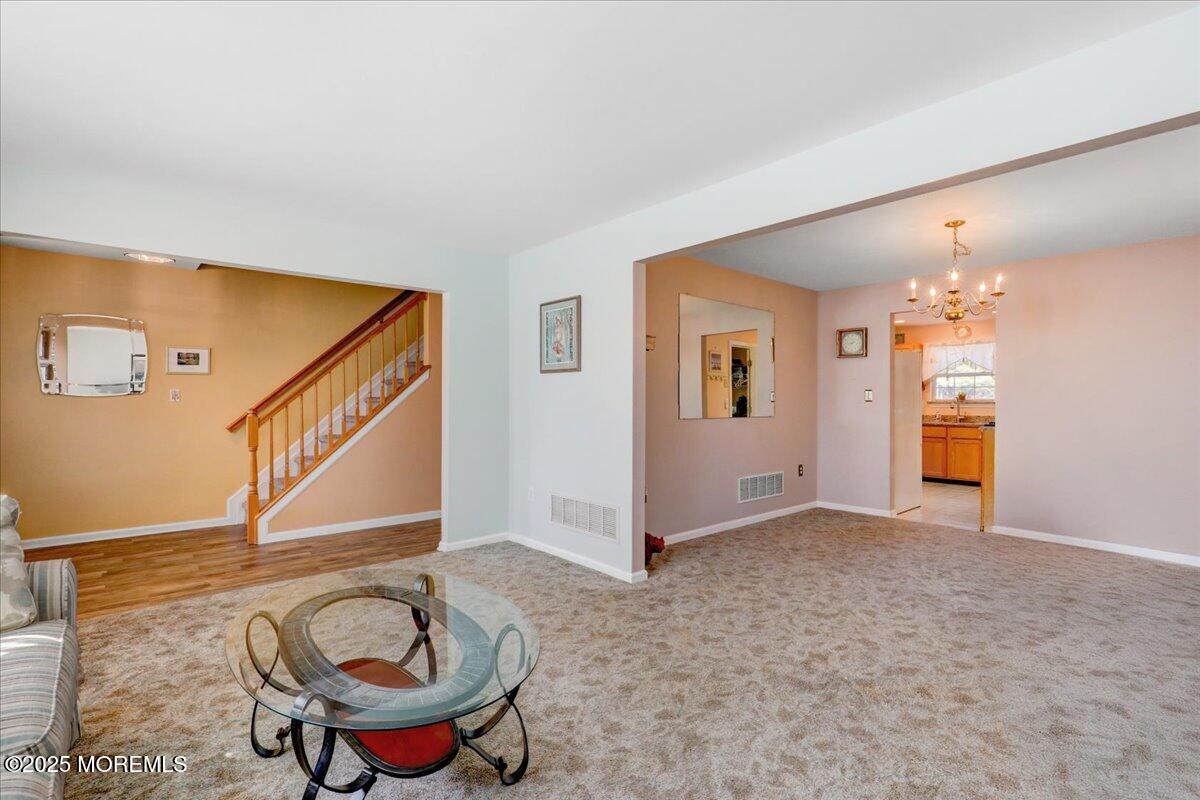 664 Adelphia Road Freehold, NJ 07728 - Photo 12 of 35 a view of a livingroom with furniture and staircase