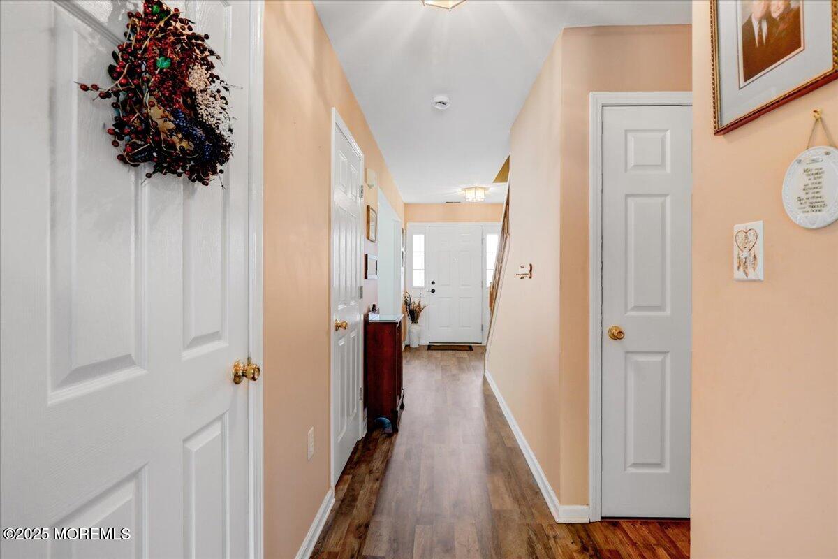 664 Adelphia Road Freehold, NJ 07728 - Photo 18 of 35 a view of a hallway with a hallway and a livingroom with furniture