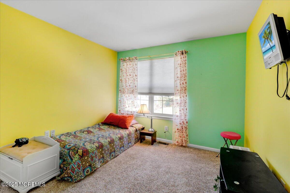 664 Adelphia Road Freehold, NJ 07728 - Photo 19 of 35 a bedroom with a bed and a window