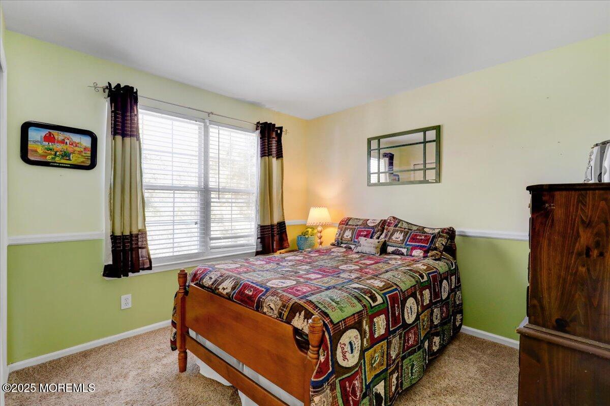 664 Adelphia Road Freehold, NJ 07728 - Photo 20 of 35 a bedroom with a bed and a window