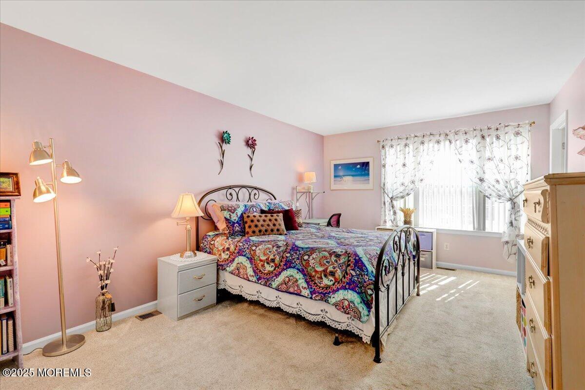 664 Adelphia Road Freehold, NJ 07728 - Photo 22 of 35 a bed room with furniture and a window