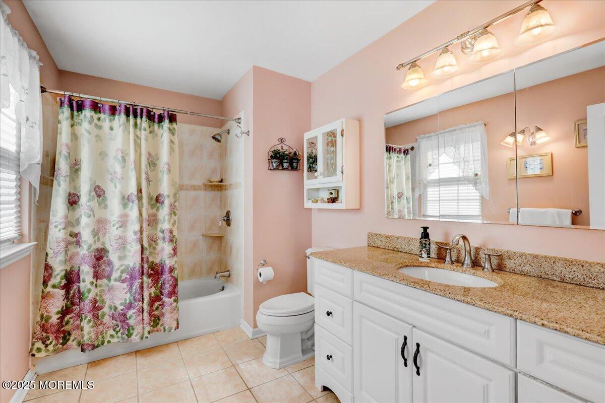 664 Adelphia Road Freehold, NJ 07728 - Photo 23 of 35 a spacious bathroom with a granite countertop sink a toilet and a shower