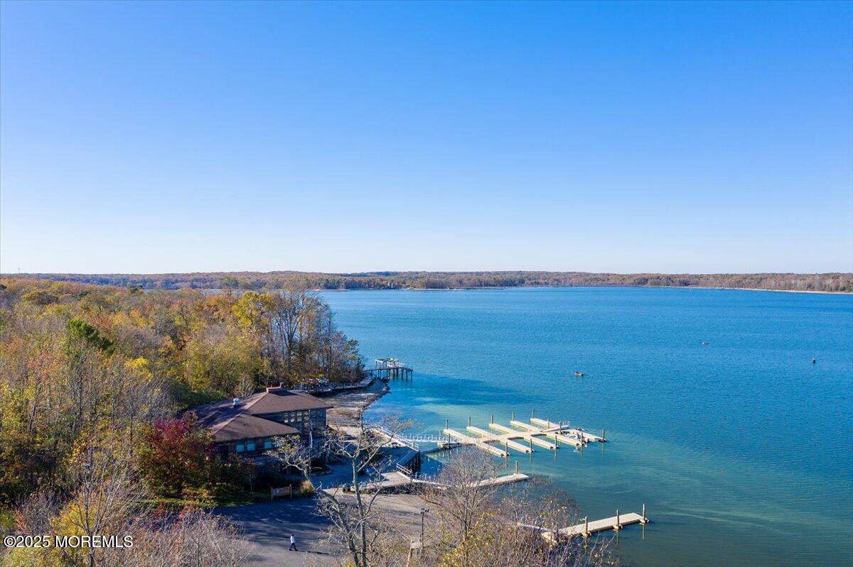 664 Adelphia Road Freehold, NJ 07728 - Photo 35 of 35 a view of a lake with couches in front of house