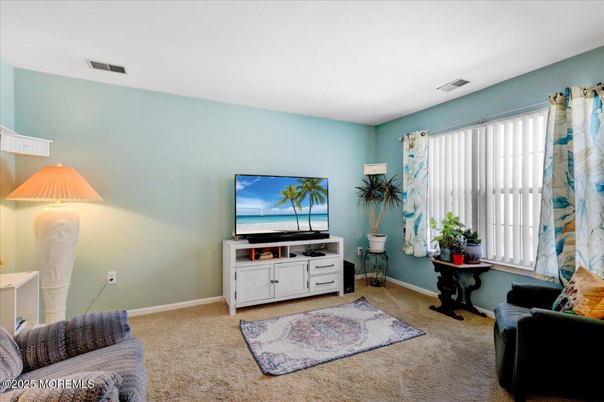 664 Adelphia Road Freehold, NJ 07728 - Photo 10 of 35 a living room with furniture and a flat screen tv