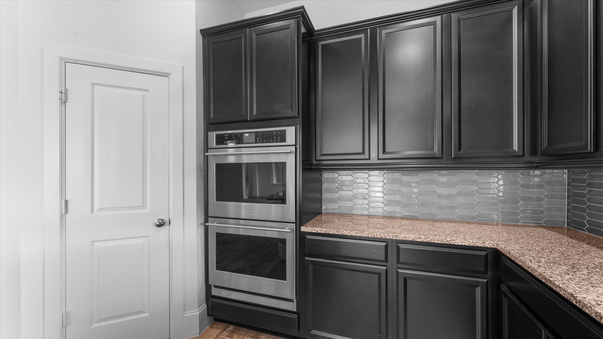 32001 Birch Briar Court Spring, TX 77386 - Photo 12 of 48 Premium built-in wall double-oven and microwave, extensive cabinetry, and a convenient walk-in pantry for exceptional kitchen storage.