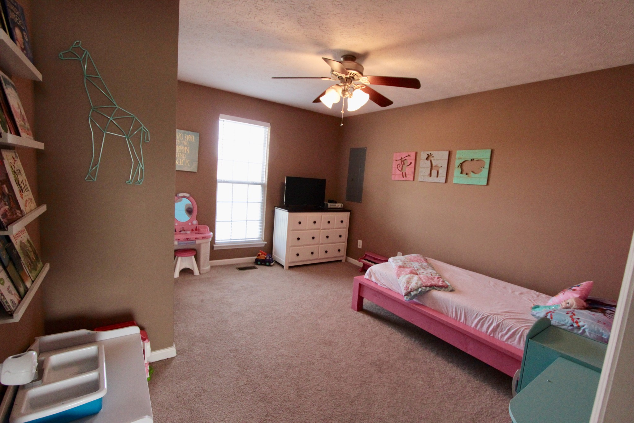628 Roberts Road Watertown, TN 37184 - Photo 8 of 11 a bedroom with a bed and a chandelier