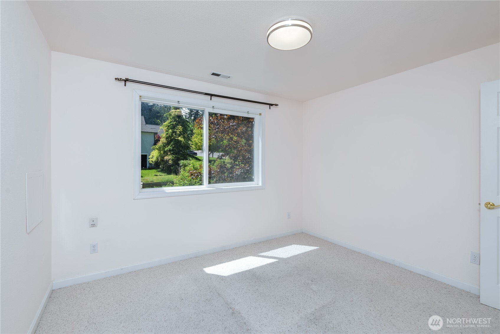 301 Mt Pleasant Estates Road Port Angeles, WA 98362 - Photo 23 of 40 an empty room with a window