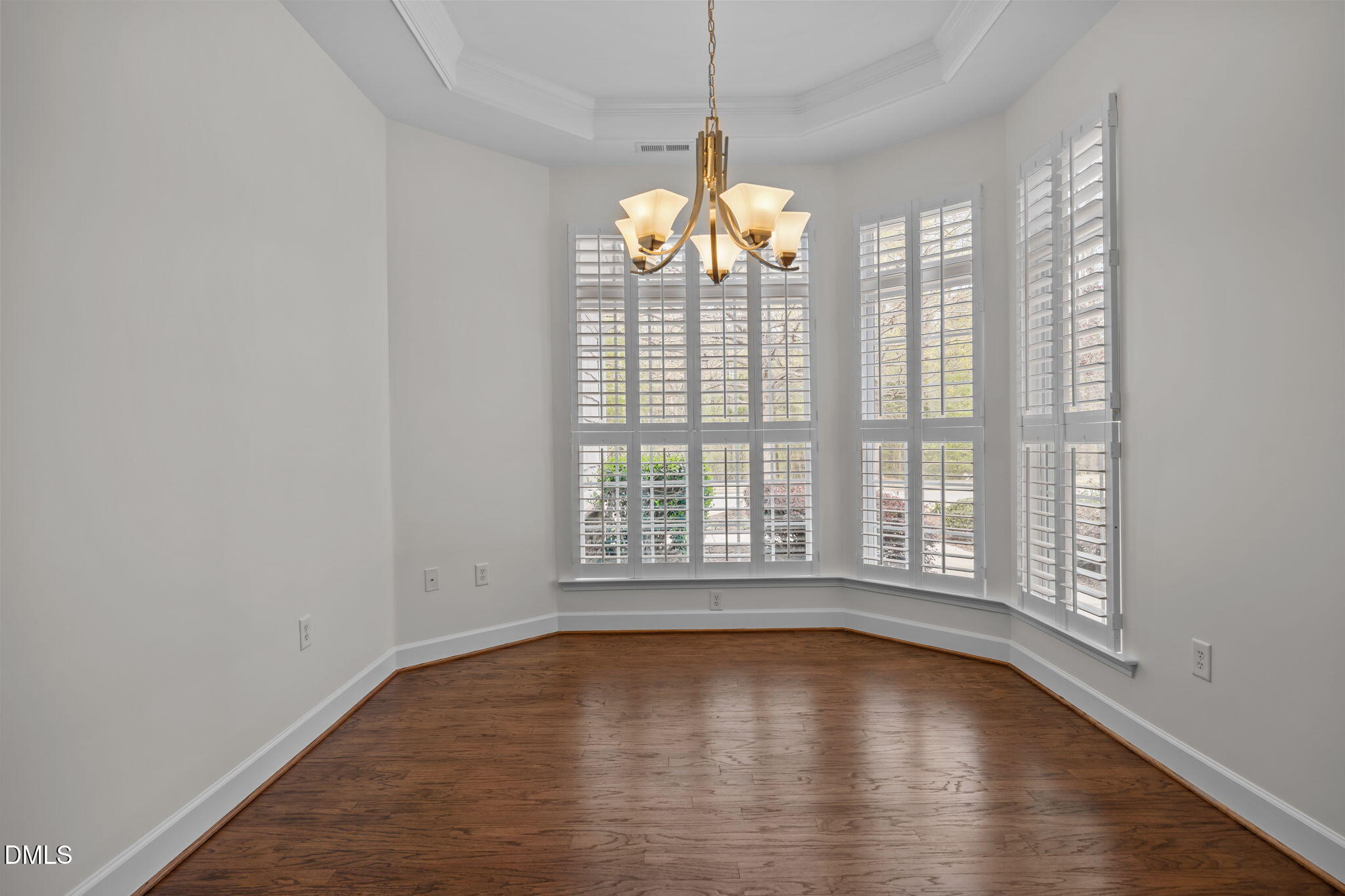 268 Beckingham Loop Cary, NC 27519 - Photo 15 of 36 a view of an empty room with wooden floor and a window