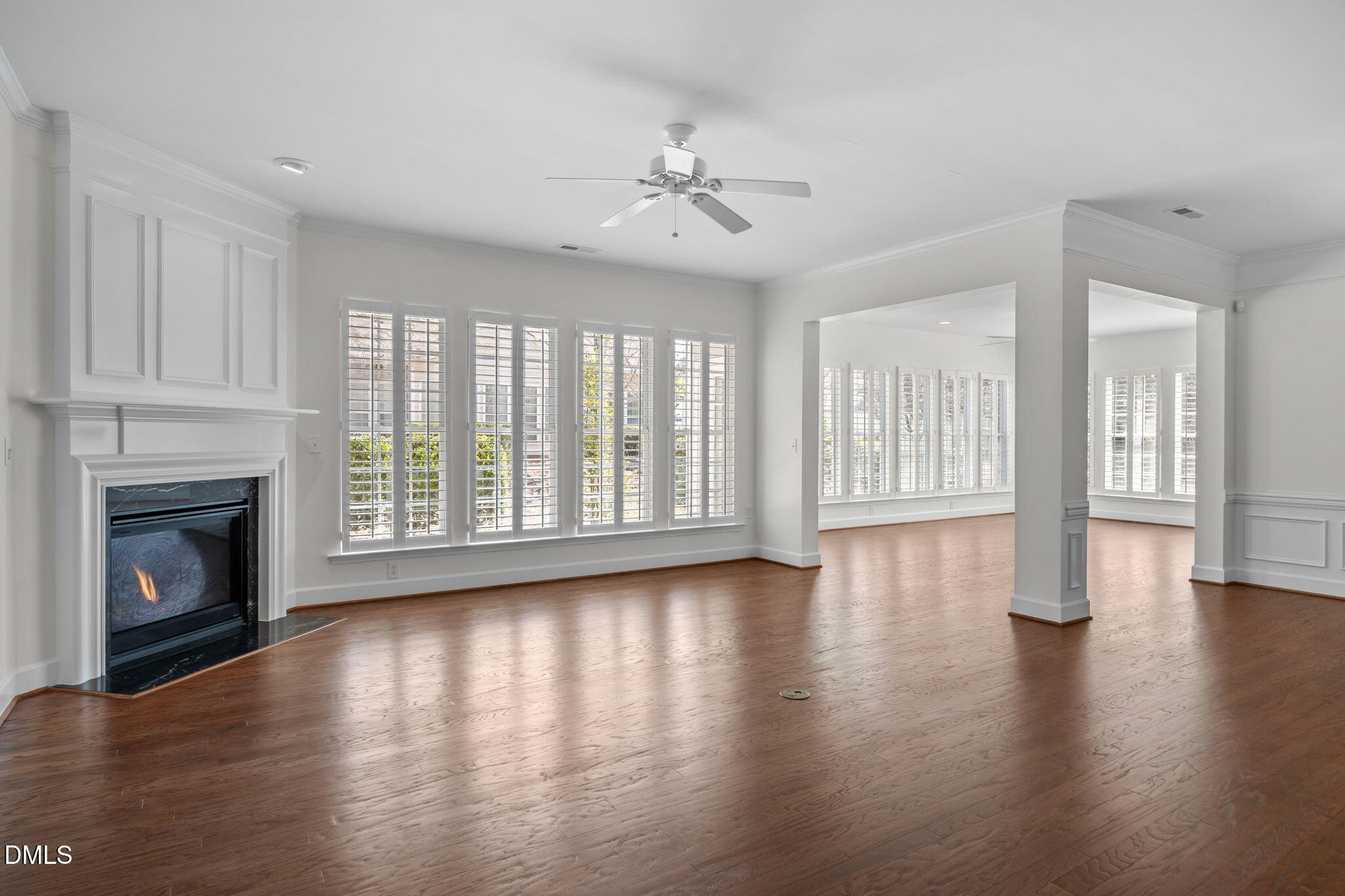 268 Beckingham Loop Cary, NC 27519 - Photo 16 of 36 a view of an empty room with wooden floor and a fireplace