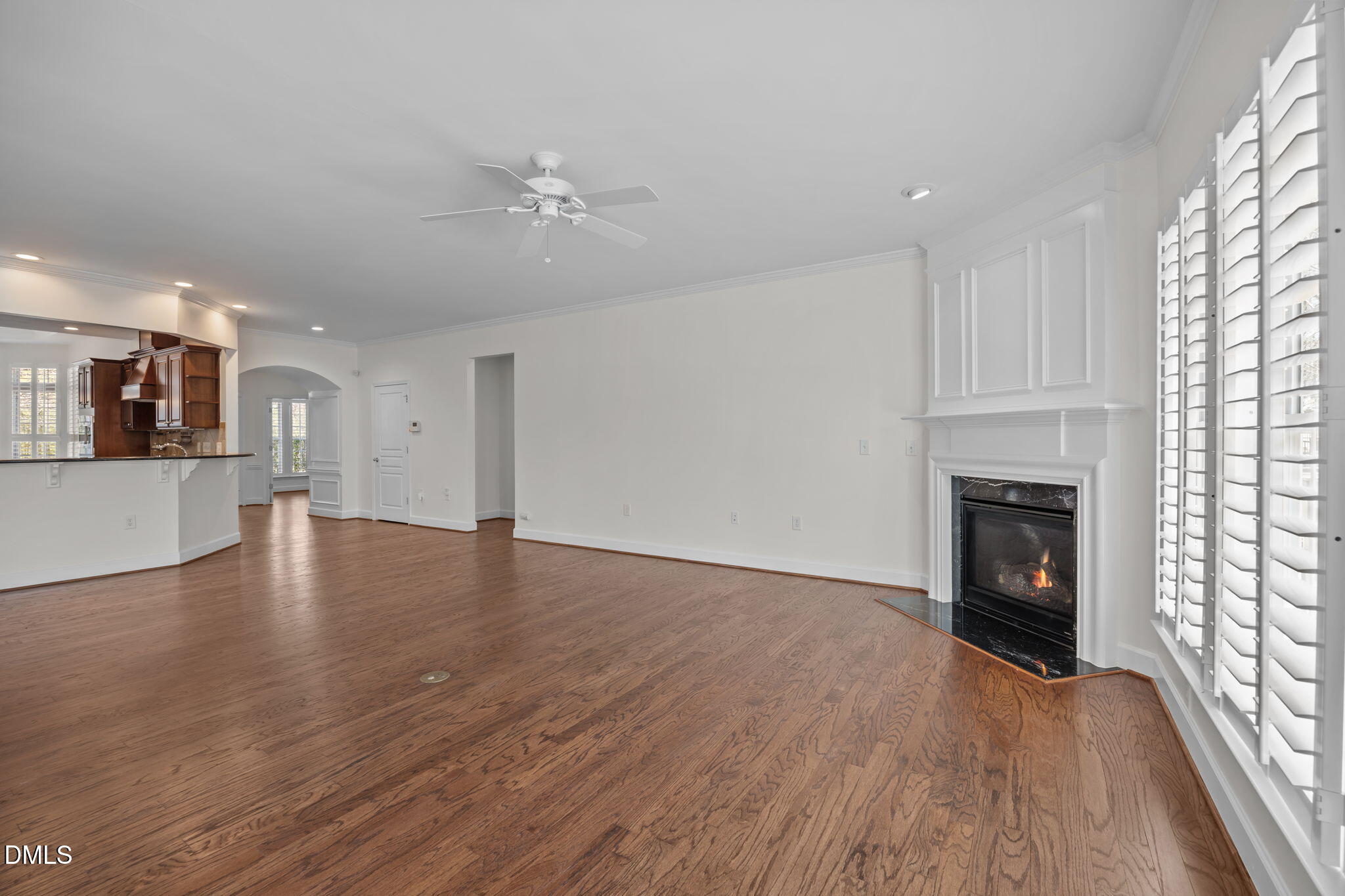 268 Beckingham Loop Cary, NC 27519 - Photo 18 of 36 an empty room with wooden floor fireplace and windows