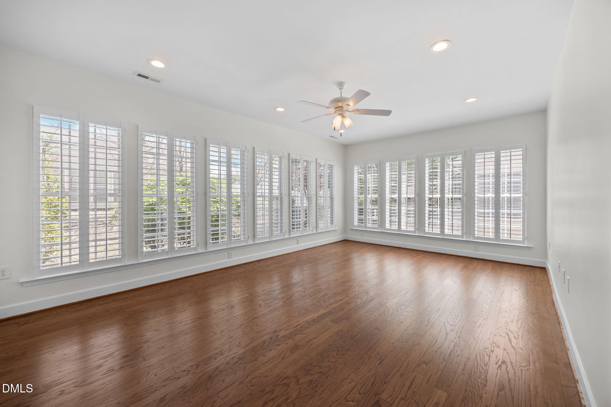 268 Beckingham Loop Cary, NC 27519 - Photo 19 of 36 a view of an empty room with wooden floor and a window