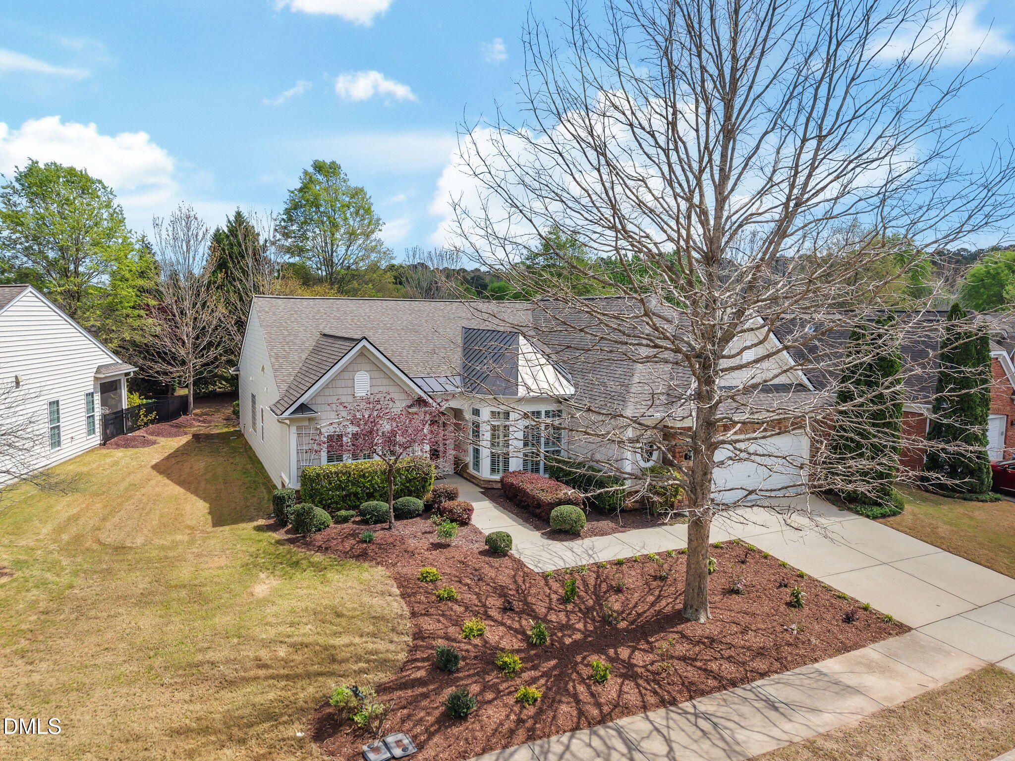 268 Beckingham Loop Cary, NC 27519 - Photo 2 of 36 a front view of a house with a yard covered with snow