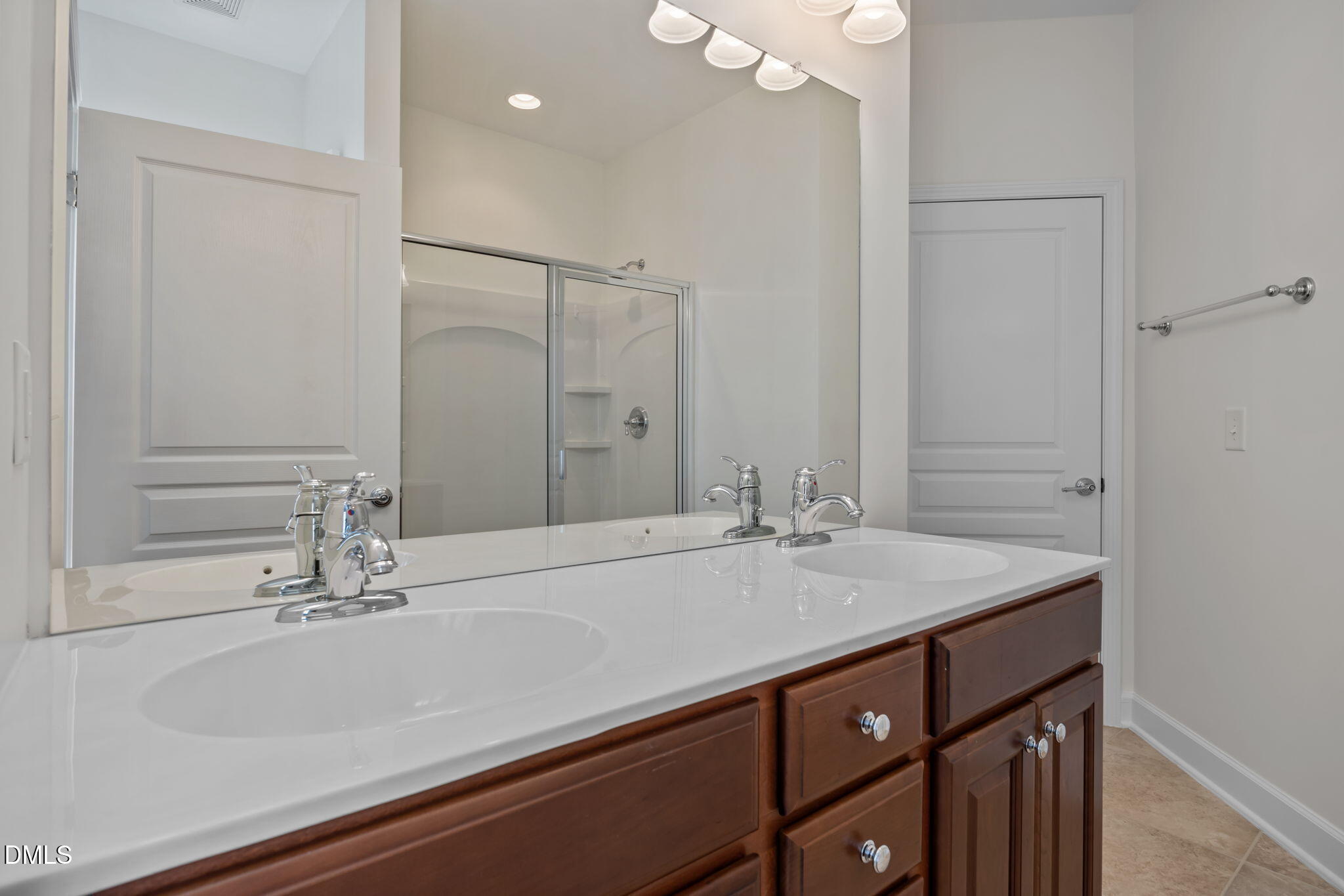 268 Beckingham Loop Cary, NC 27519 - Photo 26 of 36 a bathroom with a sink and a mirror