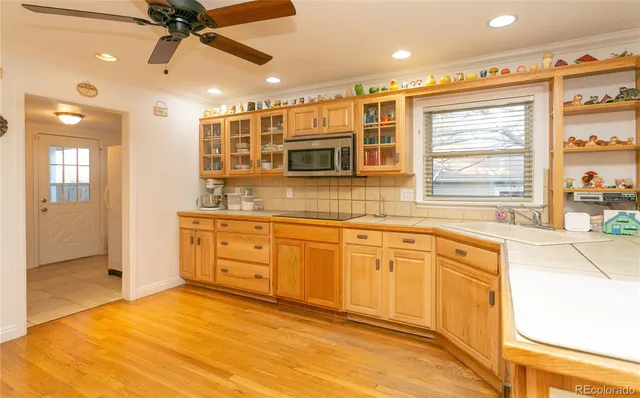 a spacious bathroom with a granite countertop sink mirror and