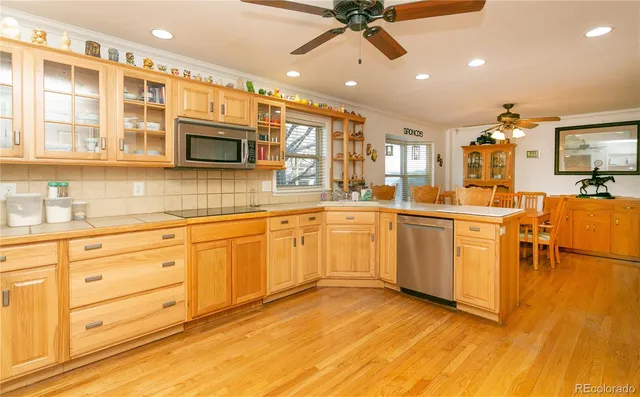 a kitchen with a sink stainless steel appliances and cabinets