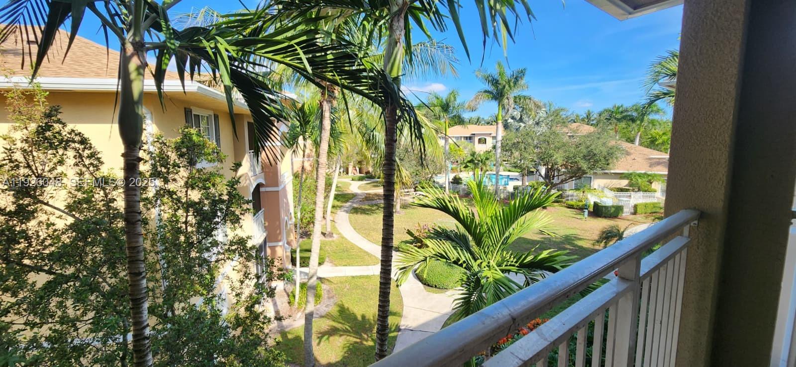 6505 Emerald Dunes Drive, Unit 307 West Palm Beach, FL 33411 - Photo 14 of 17 a view of a plant in a garden