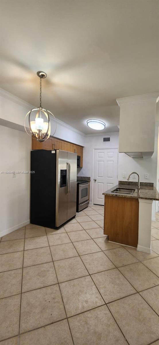 6505 Emerald Dunes Drive, Unit 307 West Palm Beach, FL 33411 - Photo 8 of 17 a kitchen with granite countertop a stove a microwave and a counter top space