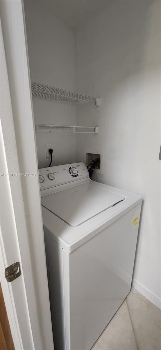 6505 Emerald Dunes Drive, Unit 307 West Palm Beach, FL 33411 - Photo 9 of 17 a utility room with dryer and washer