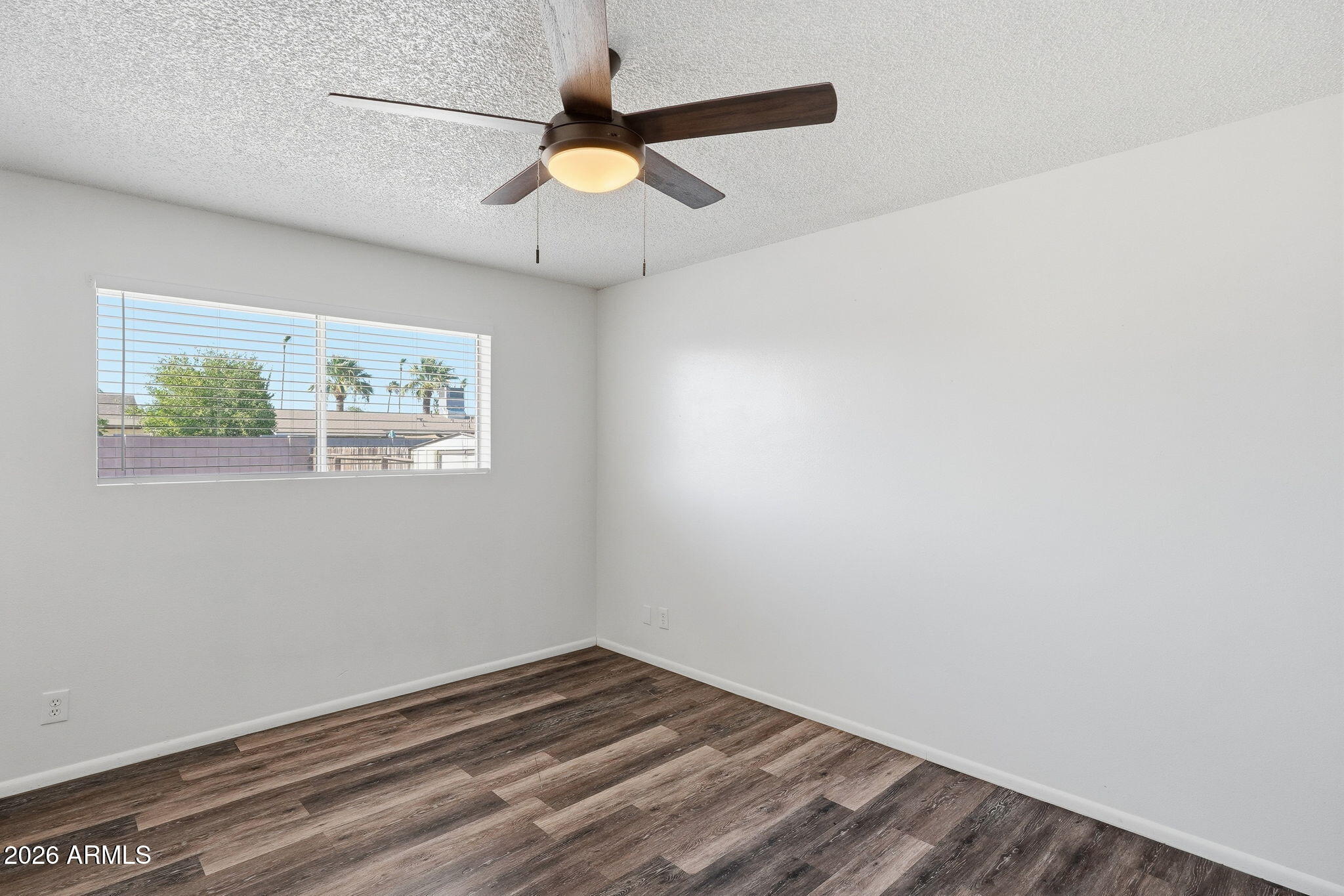 2302 East Nisbet Road Phoenix, AZ 85022 - Photo 16 of 22 an empty room with a window