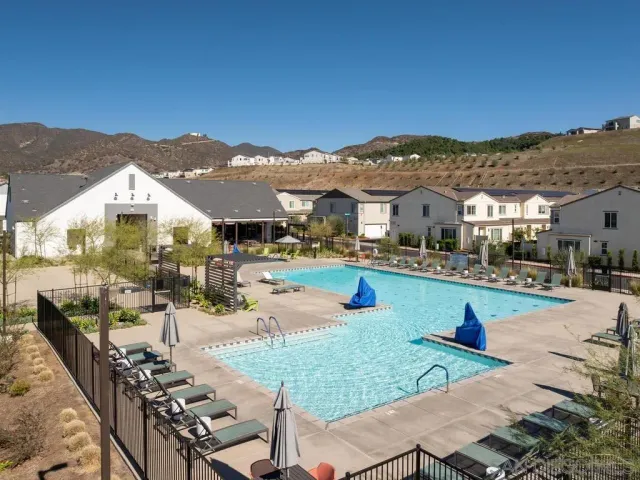 an aerial view of residential houses and outdoor space