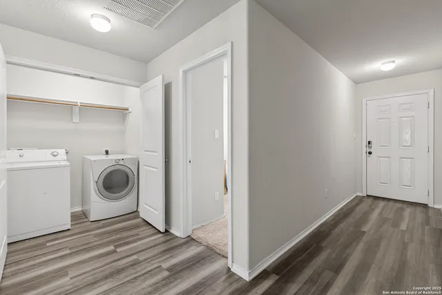 a view of a storage & utility room with washer and dryer