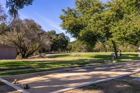 a view of a golf course with a lake