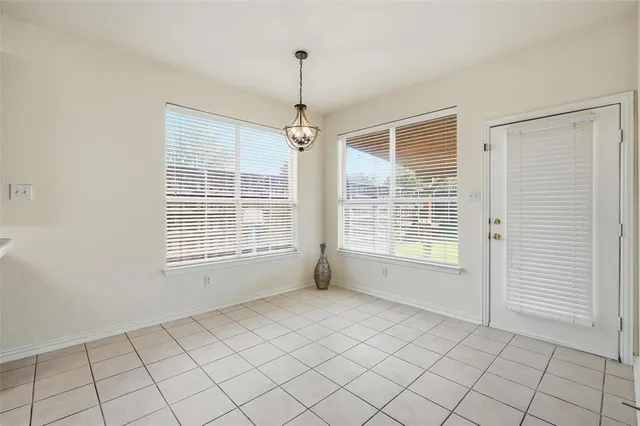 a view of an empty room with windows