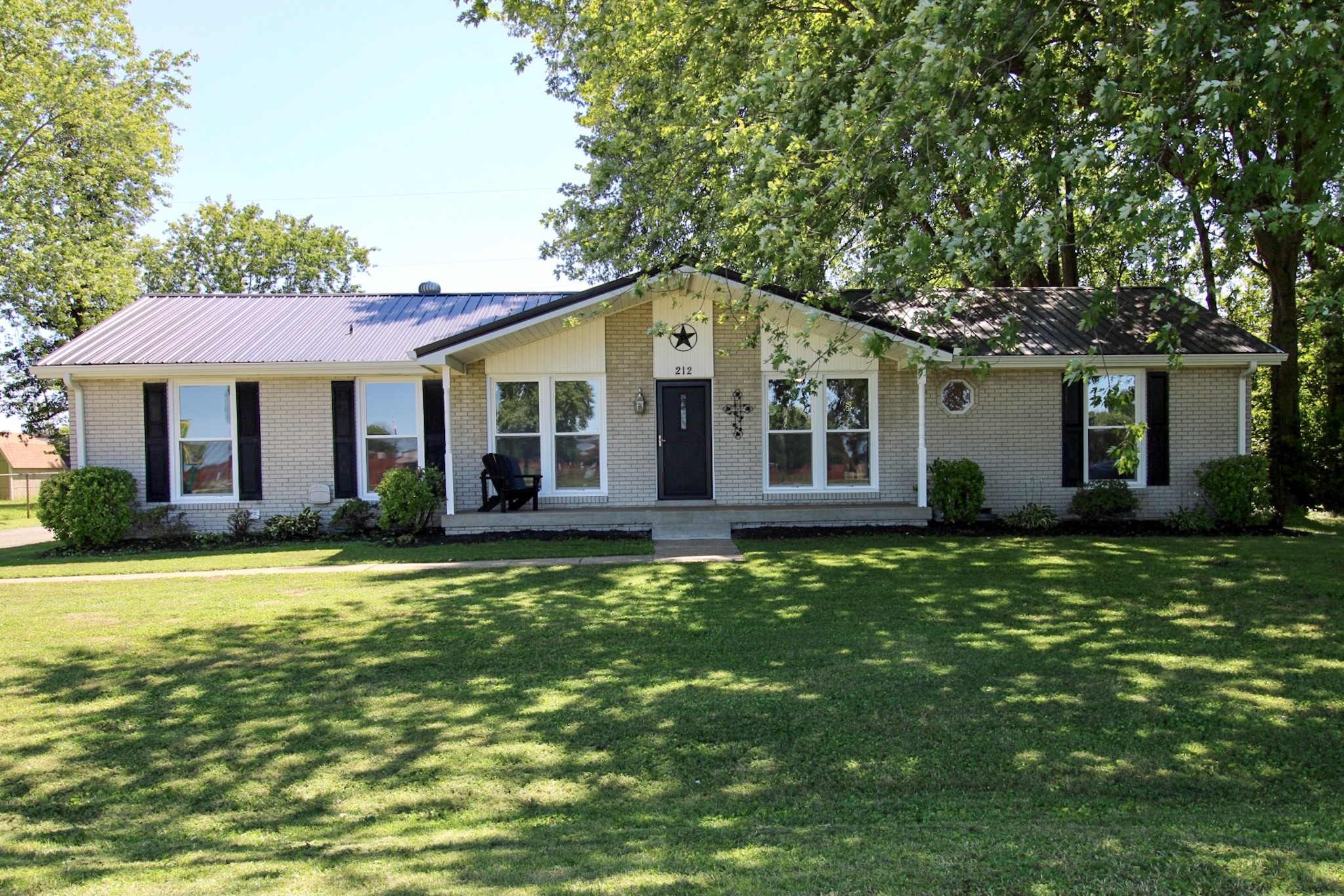 212 Cunningham Lane Clarksville, TN 37042 - Photo 1 of 19 a front view of a house with a garden